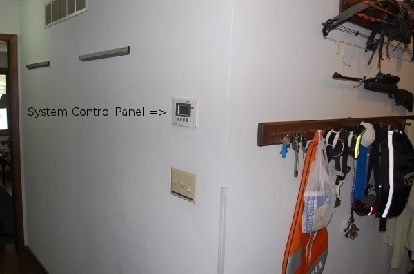 system control panel on hallway wall